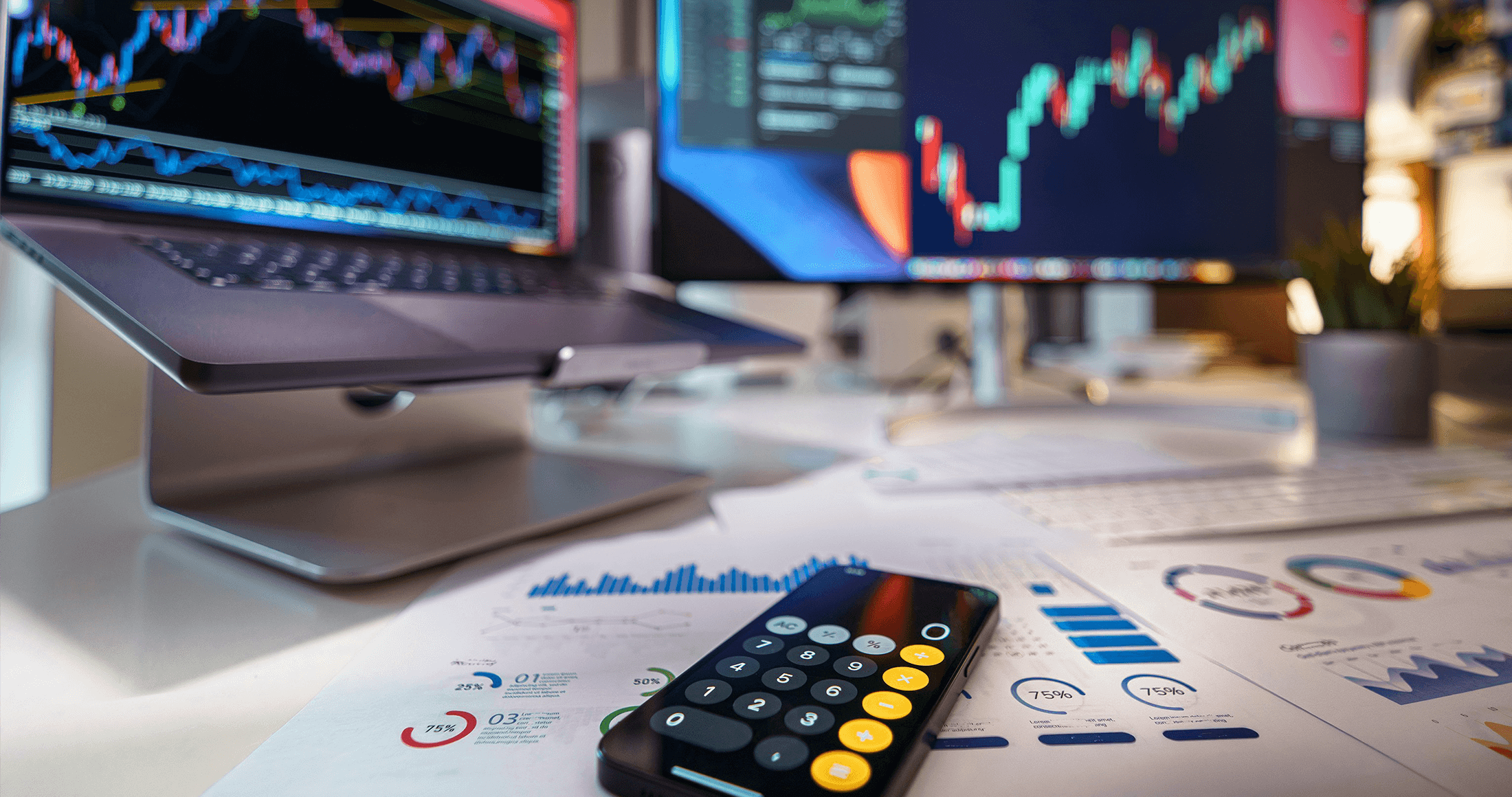 Stock market image with papers and computer on a desk